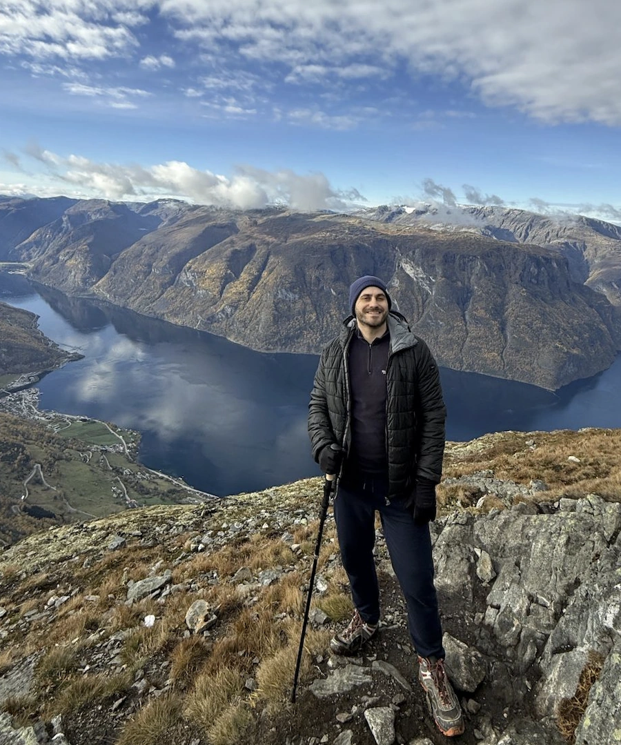 Elliot Rosenberg hiking above a fjord in Norway